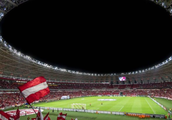 Green and White Soccer Field at Night Time